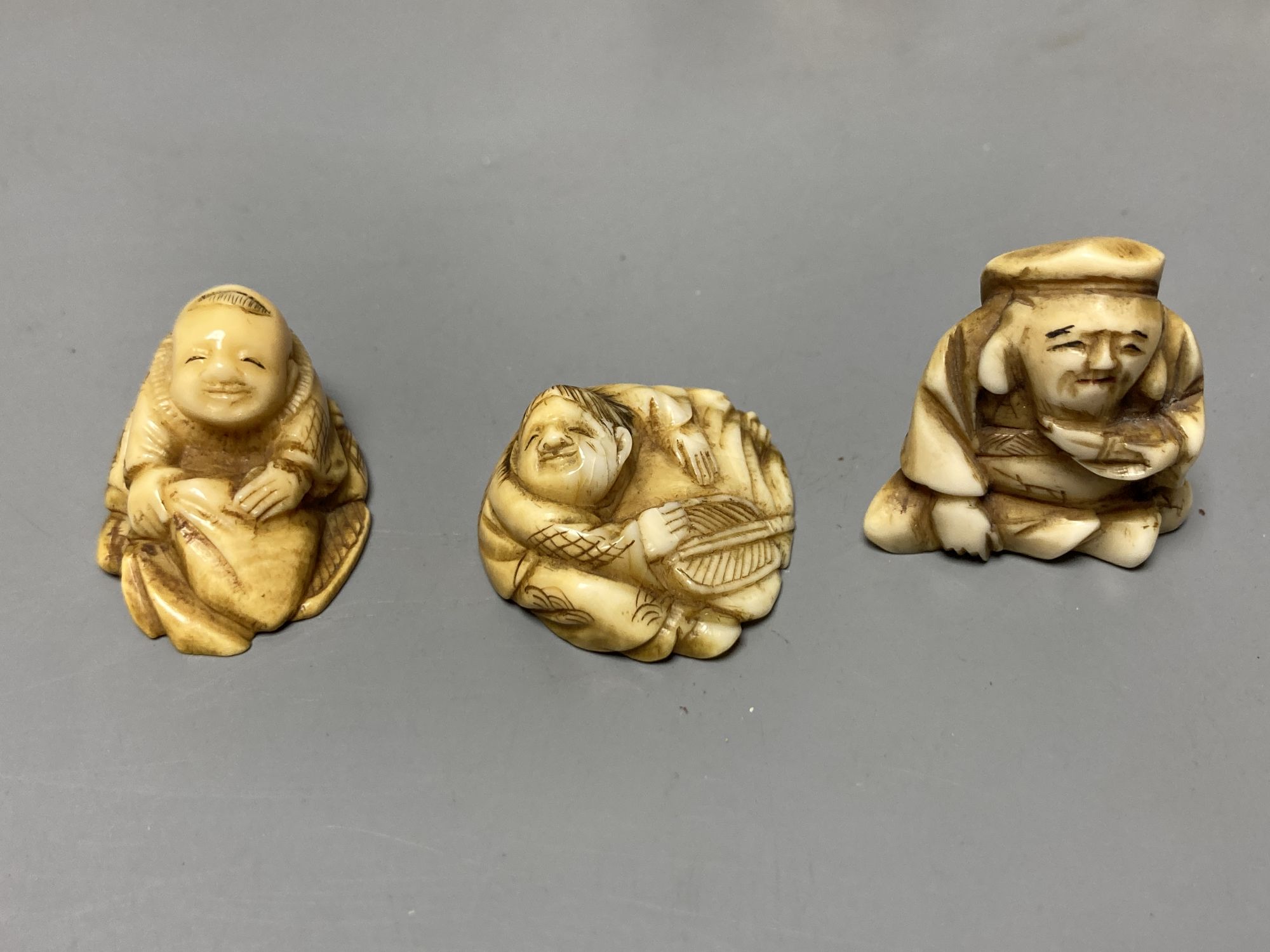 A quantity of assorted Japanese carvings, netsuke, etc.